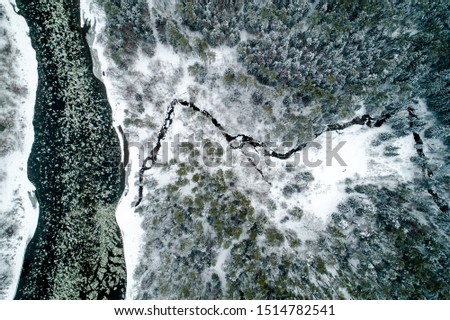 Aerial picture of winter river from above