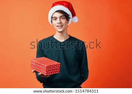 Cheerful handsome man Christmas gift decoration fun
