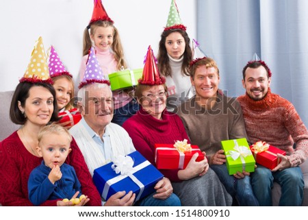 Family members making a family photo during reunion party 