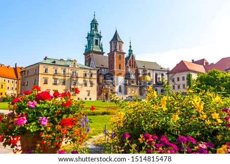 Summer view of Wawel Royal Castle complex in Krakow, Poland. It is the most historically and culturally important site in Poland. Flowers on a foreground Royalty-Free Stock Photo #1514815478