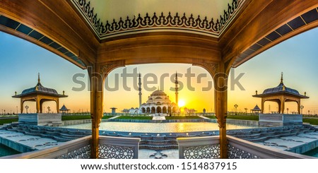 Wide angle view of Sharjah New Mosque famous Tourist Destination in Dubai Arabic Letter means: Indeed, prayer has been decreed upon the believers a decree of specified times, Travel and tourism image Royalty-Free Stock Photo #1514837915