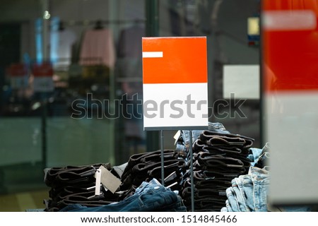 signs with mockup in a clothing store. light industry in clothing stores. sign with white and red background