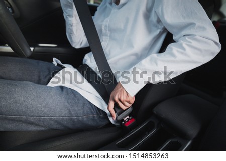 Man fasten seat belts before diving car for protection and safety,Car Safety Belts Concept.