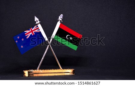 New Zealand and Libya table flag with black Background