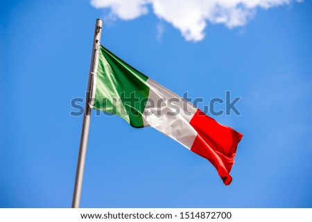 
    Flag Of Italy flying on a metal flag pole 