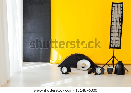 flash and accessories photo studio on a yellow background