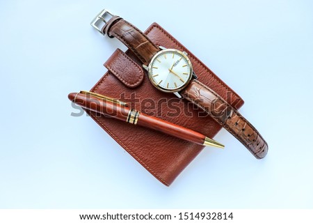 set of men's accessories. brown leather wallet, watch and pen on a white background Royalty-Free Stock Photo #1514932814