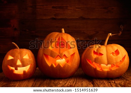 Halloween - old jack-o-lantern on wooden background