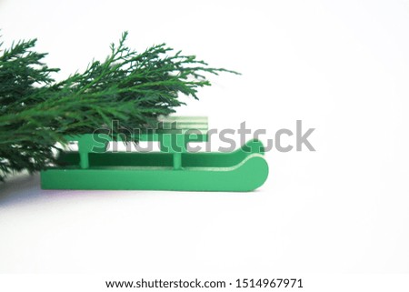New Year 2020.Christmas. Green sled delivering christmas tree with on white background. Holidays concept. Top view. Flat lay.