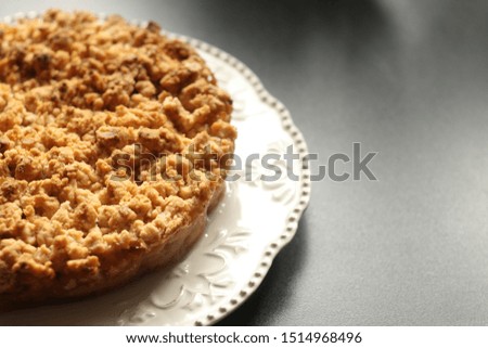 Pie, apple, white plate. Gluten Free Apple Crisp pie on a dark table. Autumn concept. Place for your design.