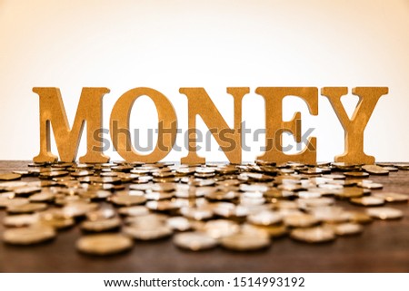 Money word with coins on floor and white background, money, financial, business concept 