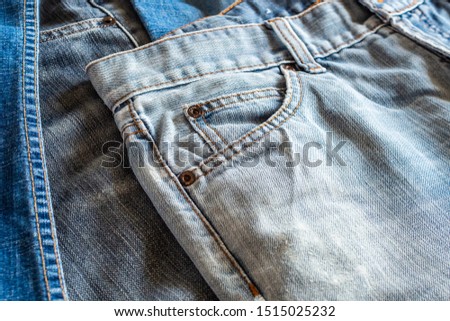 many denim blue jeans background