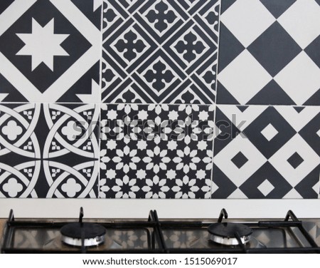 Modern geometric black and white kitchen tiles