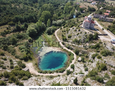 The cave spring of the Cetina River (izvor Cetine) in the foothills of the Dinara Mountain is named Blue Eye (Modro oko). Cristal clear waters emerge on the surface from a more than 100 meter-deep cav