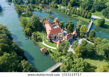 Otocec Castle ( Grad Otocec, Sankt Peter ) is 13th century catle in southeastern Slovenia. The castle is built on a small island in the middle of the Krka River. Royalty-Free Stock Photo #1515119717