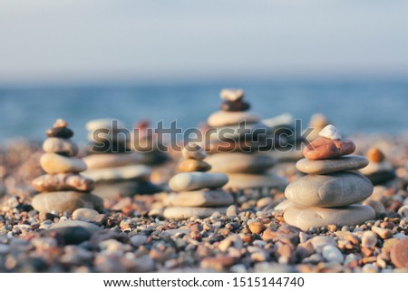 Zen pyramid of spa stones on the blurred sea background. Sand on a beach. Sea shores. Place for text.
Sea view. 
