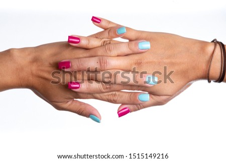 two woman hands entwined showing her nails