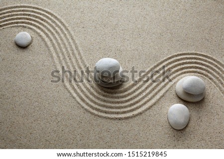 Zen garden, stone on sand. Top view