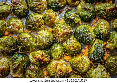 Vegetarian food. Brussels sprouts roasted in the oven with spices, salt,  black pepper and Italian herbs. It’s the healthy, vegetarian, vegan, and gluten-free side dish Royalty-Free Stock Photo #1515271019