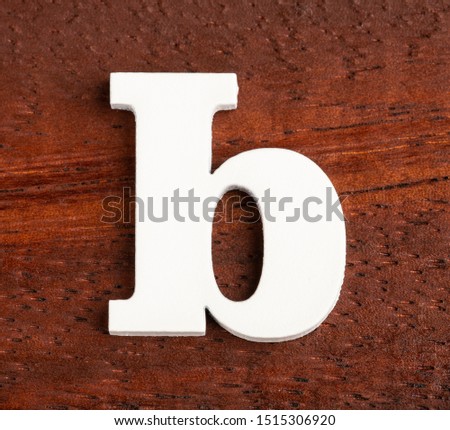 b - lowercase letter. Piece in wood