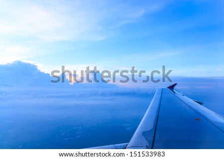 cloudy sky on the airplane before nightfall
