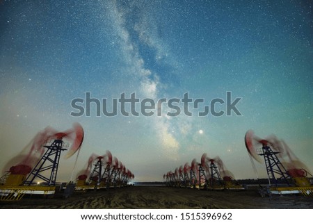 The pumping units working under the Milky Way Sky.