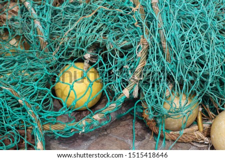 Green fishing net tangled on the ground