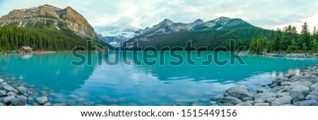 The iconic Lake Louise in summer located in Alberta, Canada with blue sky background overlooking the stunning turquoise lake.  Royalty-Free Stock Photo #1515449156