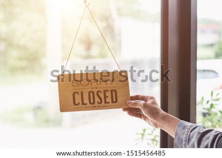 Close up sign hanging off Coffee shop door,Close sign blur background,Label word close