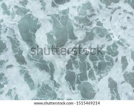 Abstract texture of water with waves. Top view of turquoise water as a background, ocean, sea, lake