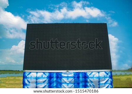 black screen outdoor monitor,Large screen and blue sky, blank screen and skies with clouds, Close up of outdoor advertising, billboard the sky is full of clouds.