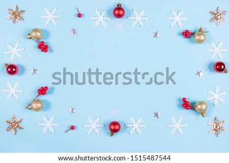 Christmas composition. Pattern made of golden, red balls and snowflakes on pastel blue background. Christmas, new year concept. Flat lay, top view, copy space