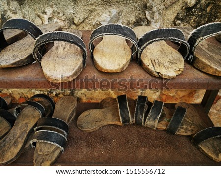 closeup of wood and leather thong slip on sandals out side mosque Antalya Turkey