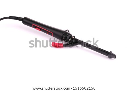Curling iron on a white background. High resolution photo. Full depth of field.