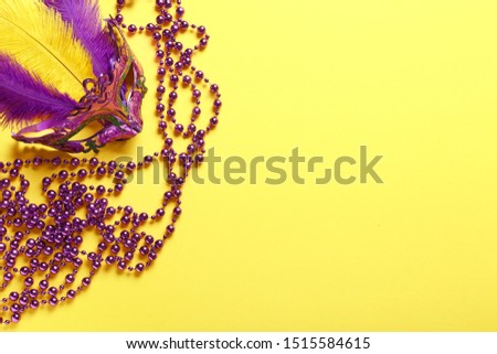 Carnival mask with decor on color background