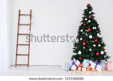 Christmas tree with gifts of the new year internet white room