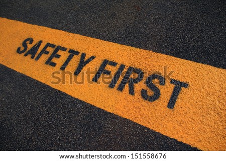 Safety First sign on caution strip. 
