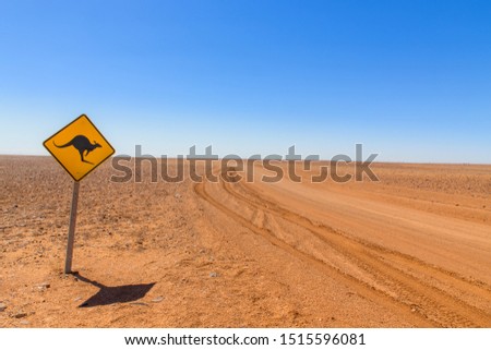 Australian kangaroo roadsign in red outback landscape