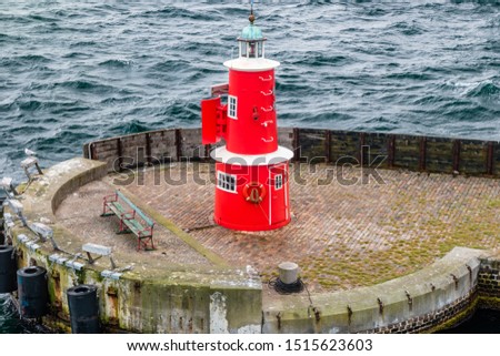 Old red and white lighthouse in Helsingor, Denmark.