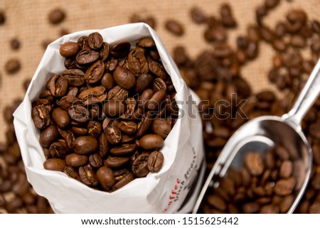 Freshly roasted coffee beans are packaged for sale