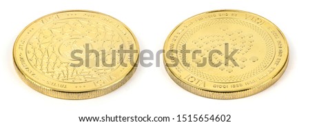 Face and back side of the crypto currency golden iota isolated on white background. High resolution photo. Full depth of field.