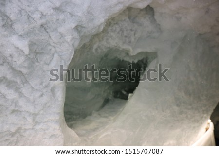 Inside a glacier in Swiss Alps - frosty cave