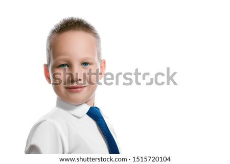 Beautiful European boy with a light smile in a white shirt with a blue tie in the character of a successful self-confident businessman with an empty place for text isolated on white background