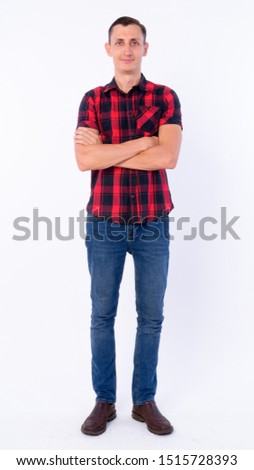 Full body shot of hipster man with arms crossed
