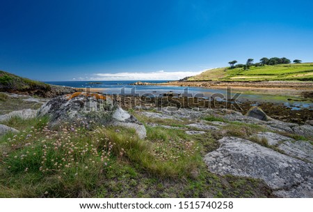 Coastal view across headland to sea, St Mary's, Isles of Scilly Royalty-Free Stock Photo #1515740258