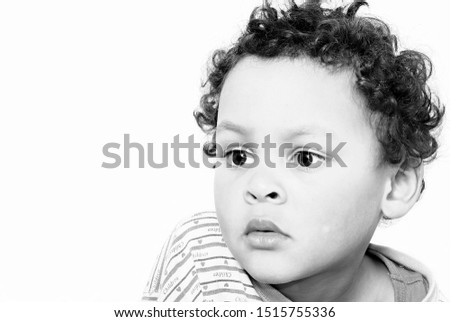 little boy not smiling stock photo