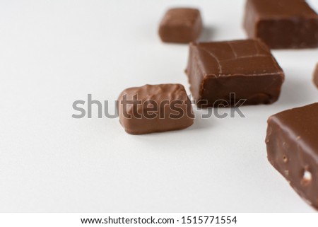 Assorted chocolates on white background