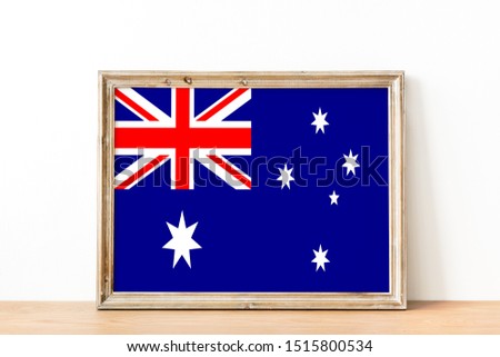 Flag of Australia on photo frame. Australia Flag in wooden frame.