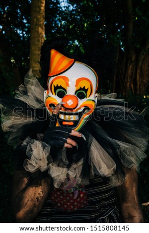 Hellga Scary Clown Covering Face with Vintage Clown Mask