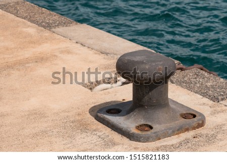 Empty coastal mooring or towing bollard for the boat, yacht or vessel.